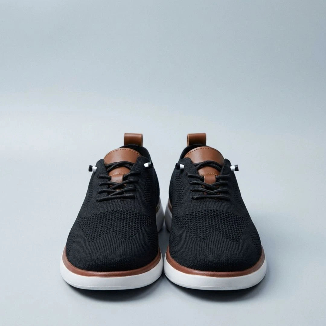 The Cottesloe knit sneaker in black — top view showing engineered knit upper and leather tongue