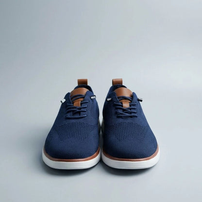 The Cottesloe knit sneaker in Navy — top view showing engineered knit upper and leather tongue